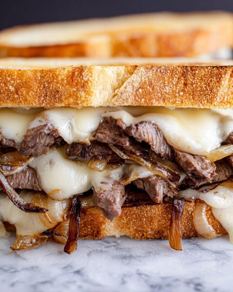Herb Butter Steak Sandwich with Melted Havarti and Caramelized Onions Recipe