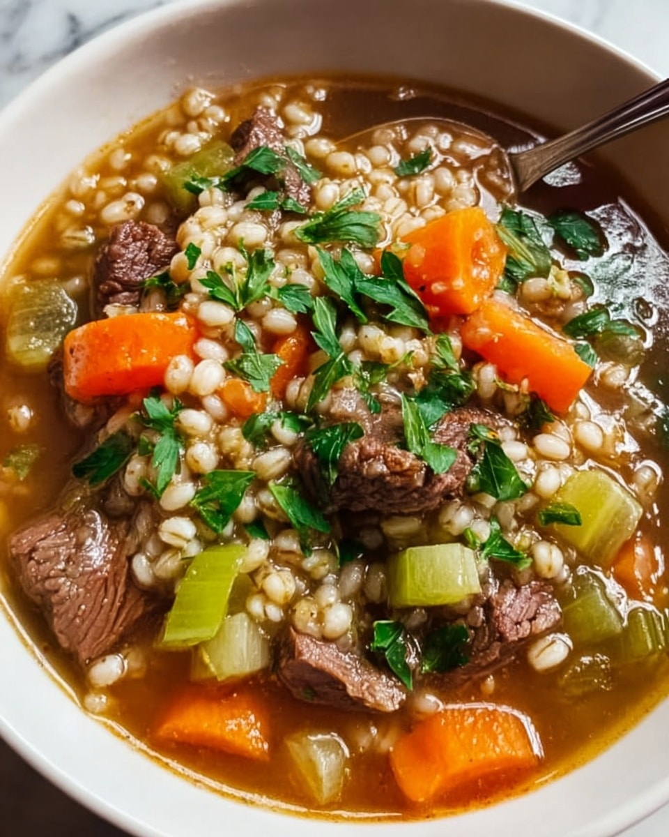 The image shows a white bowl filled with a hearty soup made of several layers: the bottom layer is a clear brown broth, followed by a thick layer of light beige barley grains. Floating on top are vibrant chunks of orange carrots and pale green celery, mixed with tender, dark brown beef pieces. The soup is garnished with fresh green parsley, adding a splash of color and texture. The bowl sits on a white marbled surface, with the spoon partially visible inside the bowl. photo taken with an iphone --ar 4:5 --v 7